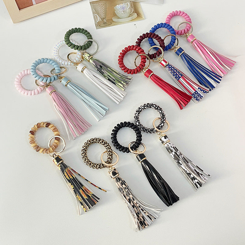 Brazalete al por mayor cable PU Leopardo Tassel Anti-Lost Keychains